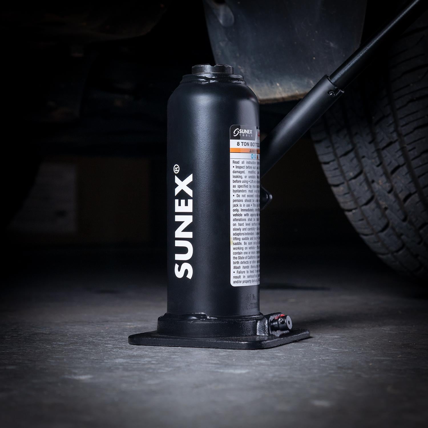 SUNEX Bottle Jack placed below a vehicle