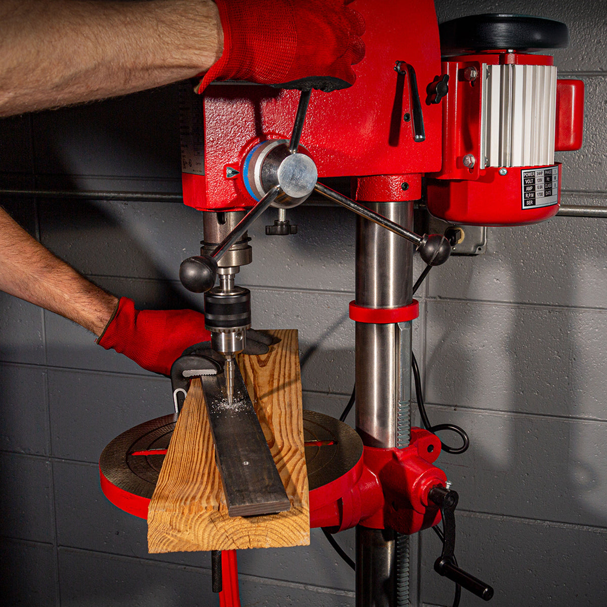 SUNEX Tools Drill Press being used by a technician.