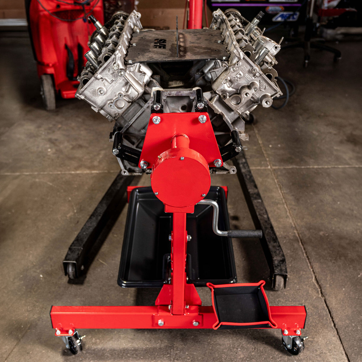 The SUNEX Rotating, Folding Engine Stand being used to hold an engine for servicing.