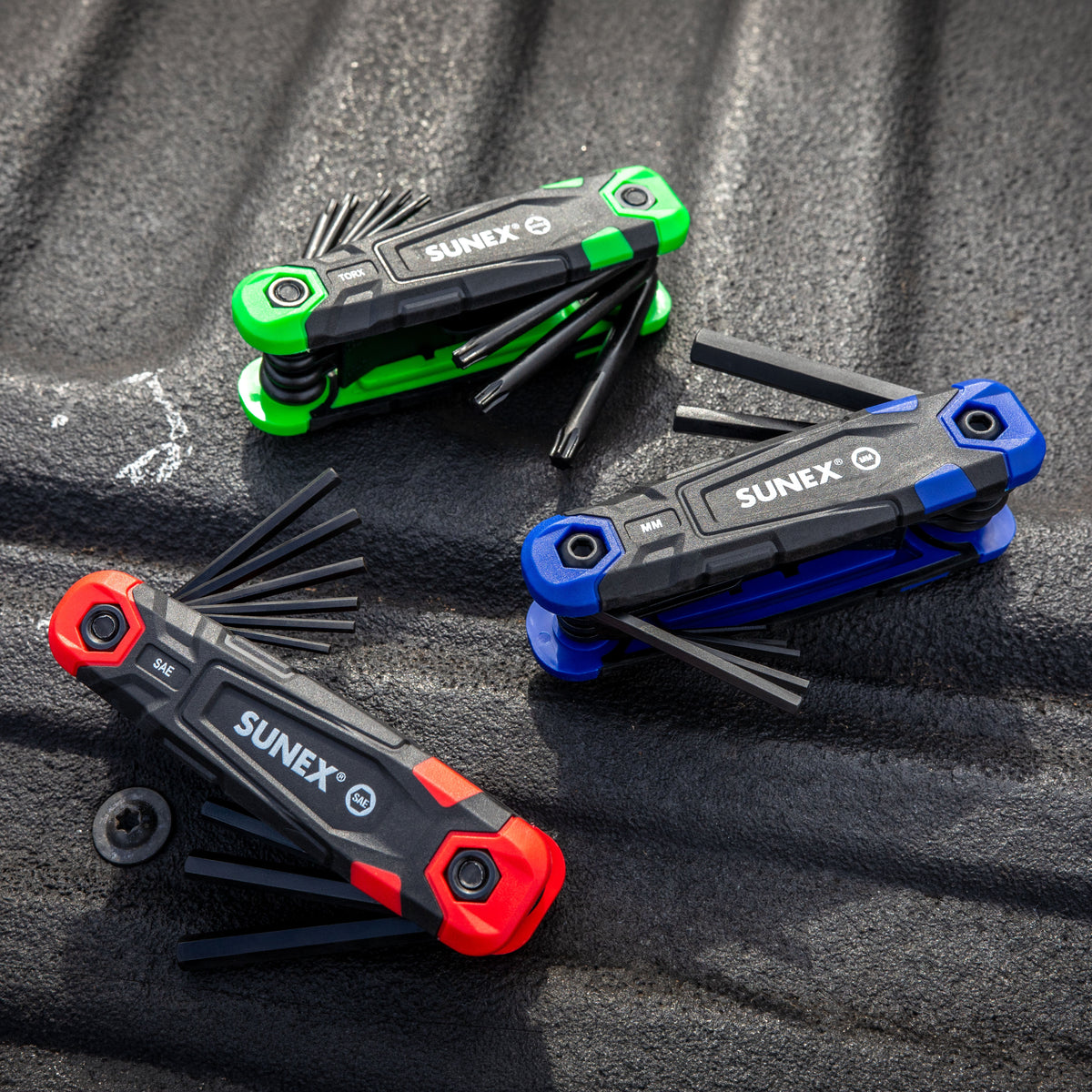 SUNEX Folding Keys assorted on a truck bed of a truck.