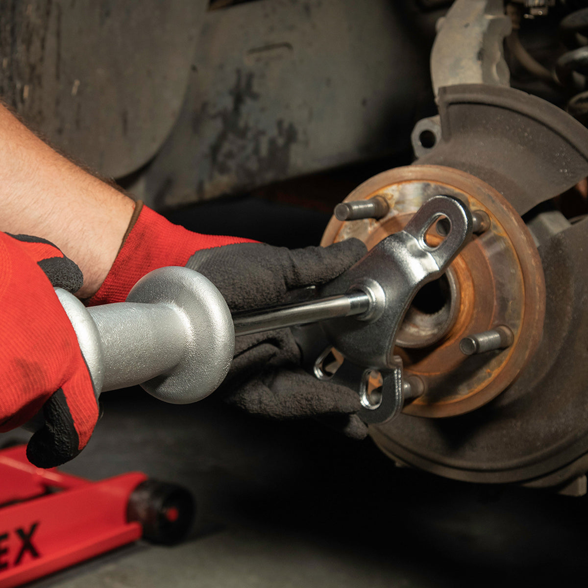 A Slide Hammer Puller from SUNEX Tools being used in an automotive application.