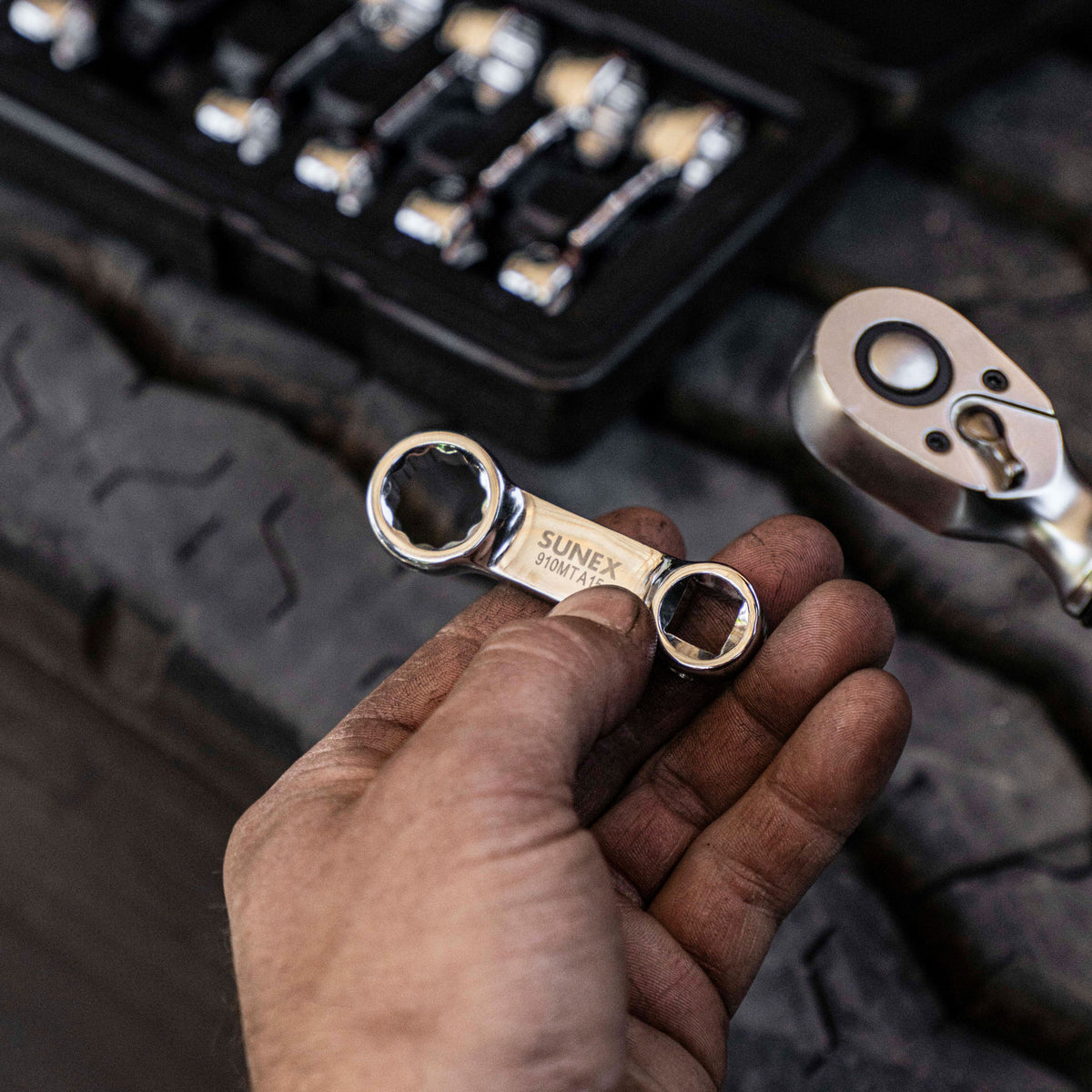 SUNEX Torque Adapters being used with a torque wrench by a technician.