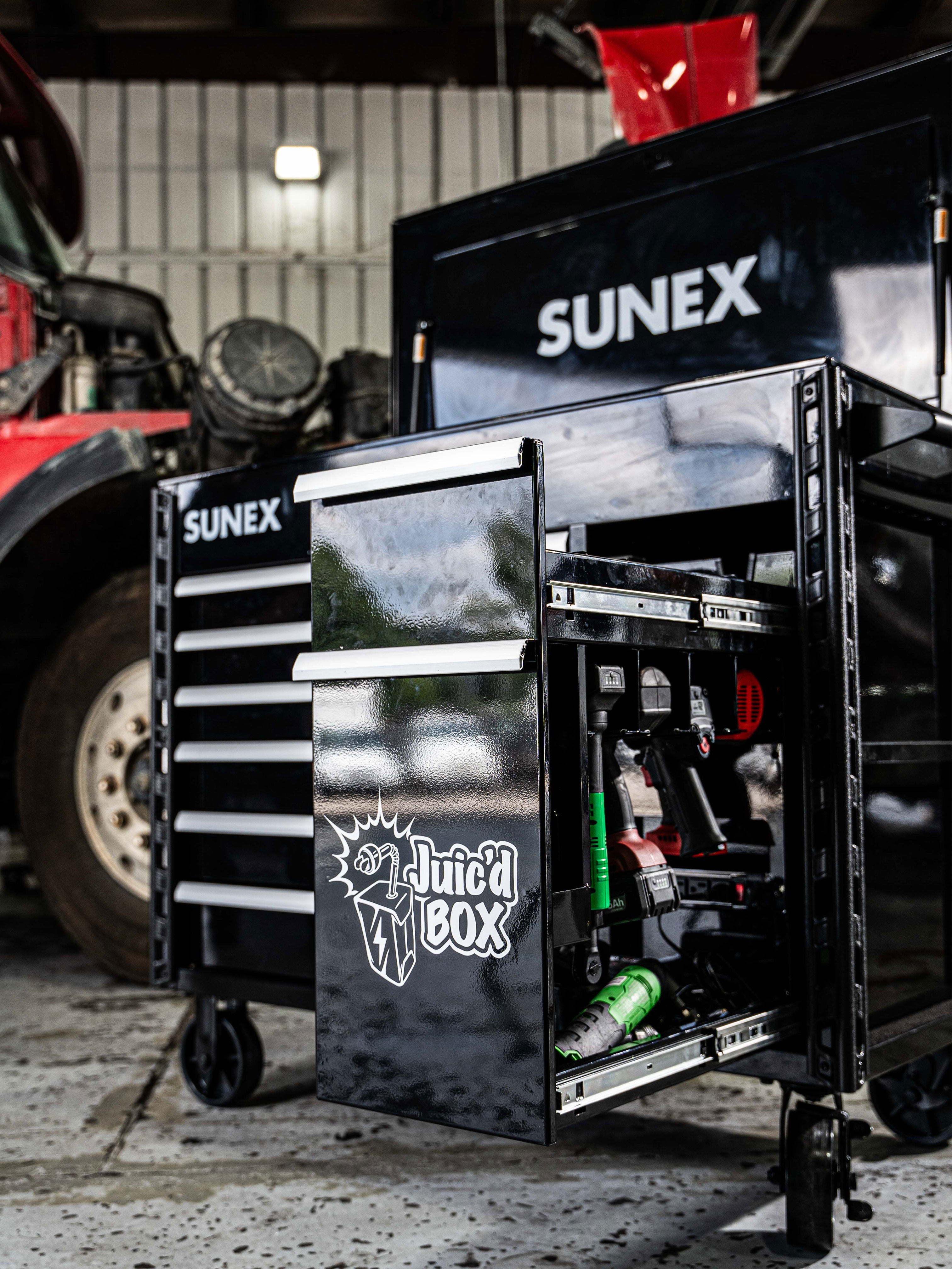 SUNEX Tools Juic'd BOX 50" 7 Drawer Powered Cart with unique access from both sides of the power drawer and unique long neck power ratchet storage in a garage environment.